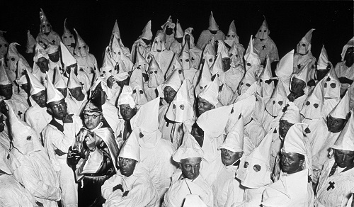 Ku Klux                                                          Klan (KKK)                                                          meeting, South                                                          Carolina, 1951.                                                          Â© Heirs of W.                                                          Eugene Smith